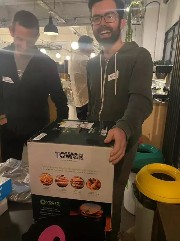 Participant with their prize air fryer