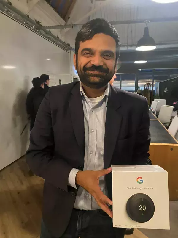 Participant with their prize nest learning thermostat