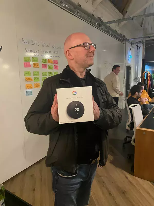 Participant with their prize nest learning thermostat